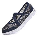 Women's casual flat shoe with breathable mesh upper in beige colour, showing round toe and flat heel design.