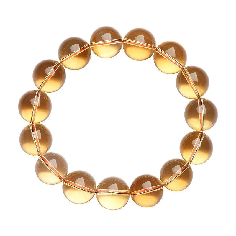 Natural citrine scattered beads ball bracelet showing polished gemstone beads in yellow-amber tones on a wrist.