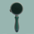 Green and pink double sided cat grooming brush with release button and flea comb