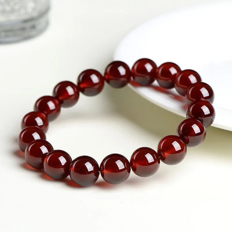 Natural orange red garnet crystal bead bracelet with retro design on wrist