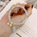 Chinese style jade bracelet with gourd design featuring natural emerald jade ins material.