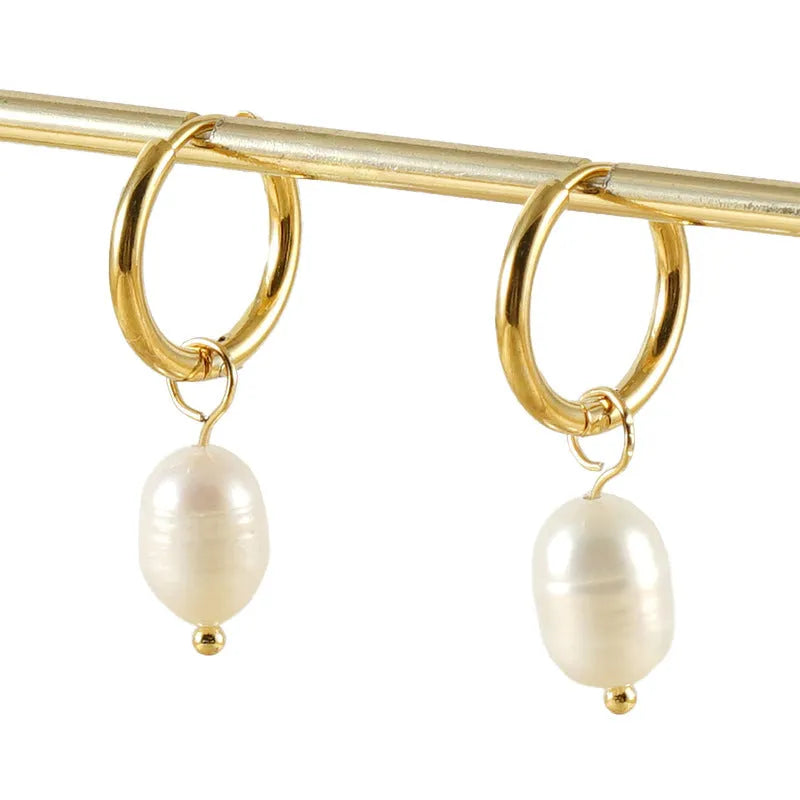 Gold-coloured geometric pearl earrings with stainless steel construction and titanium posts
