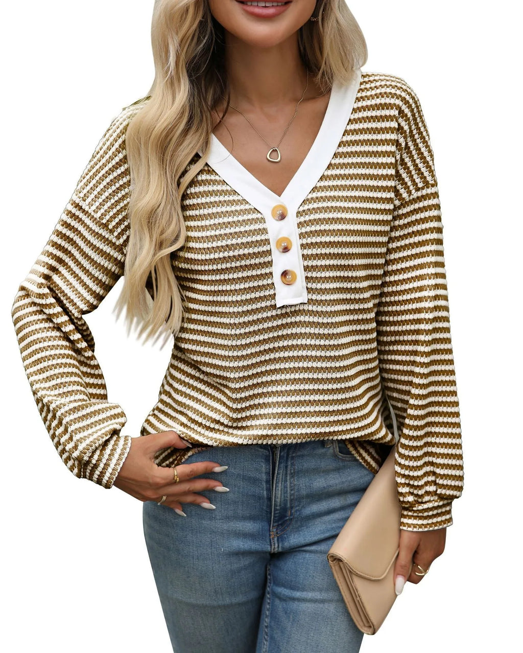 Women's loose-fitting long-sleeved V-neck top with button detail and patchwork design.