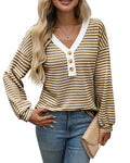 Women's loose-fitting long-sleeved V-neck top with button detail and patchwork design.