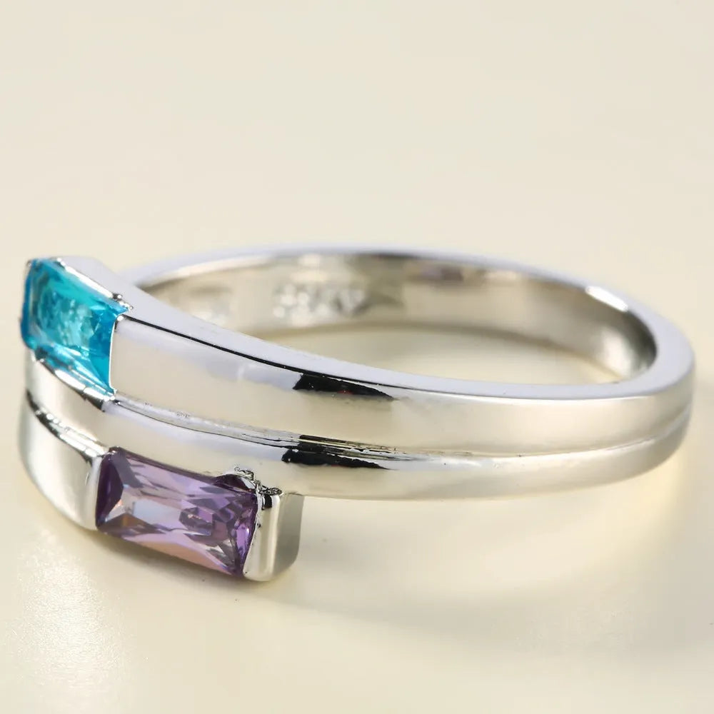 Copper zircon ring with electroplated silver finish showing stone inlays and metallic band