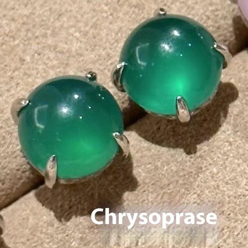 Round chalcedony stud earrings with four claw copper settings in green, white, or pink.
