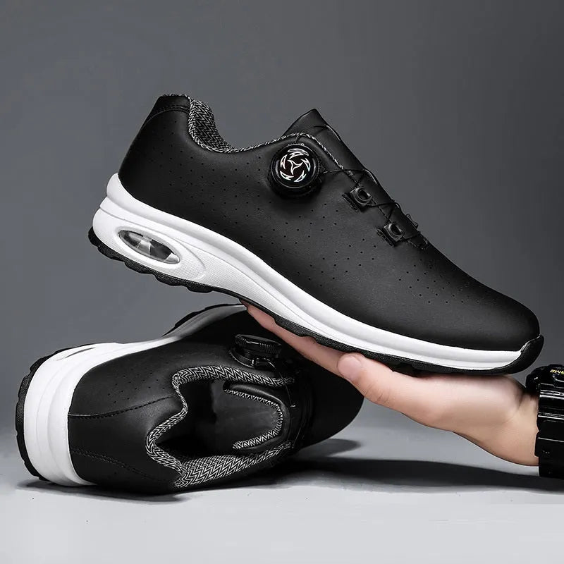 Men's black low-top casual shoes with mesh upper and white laces on a flat composite sole.
