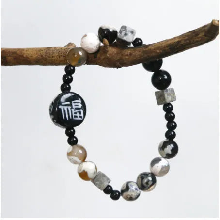 Hand-woven unisex bracelet with natural glitter stone, black agate, ceramic and round geometric beads