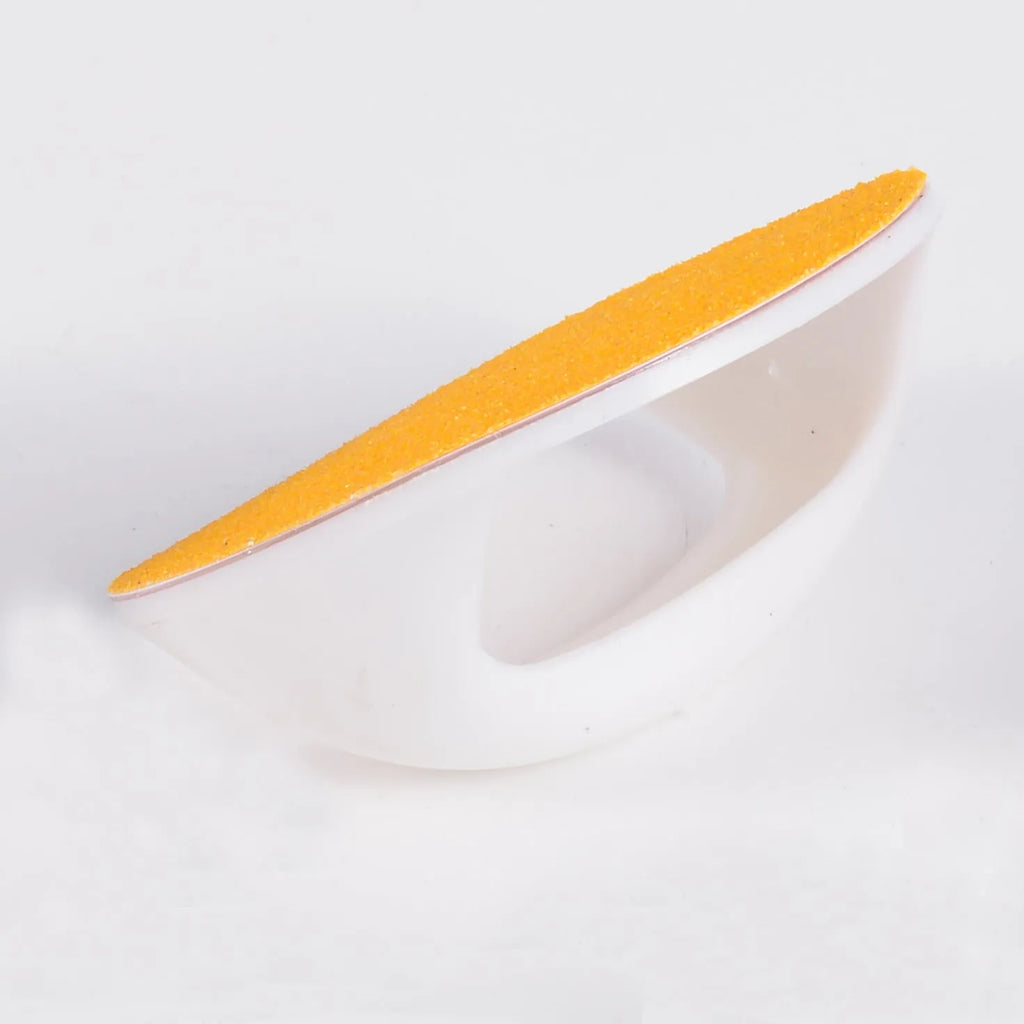 Upgraded dog nail scratch board with ergonomic handle in one of four colours, shown next to replaceable sandpaper sheet.