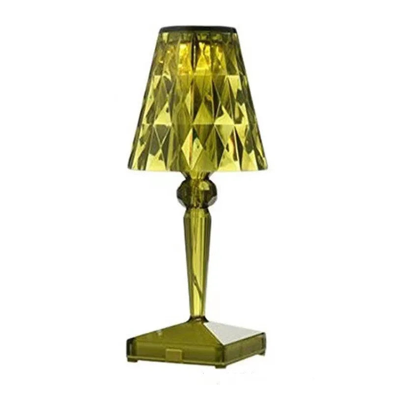 Rose gold plated portable touch night light with rechargeable battery on a surface