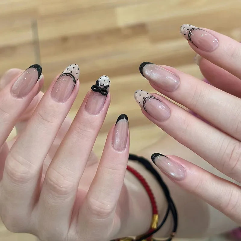 Glossy false nails with transparent pink French tip design showing 10 complete sets