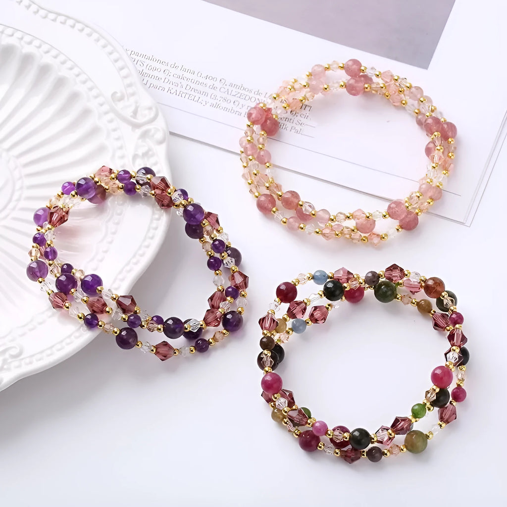 Women's adjustable crystal bracelet with three gemstone rings on rope band