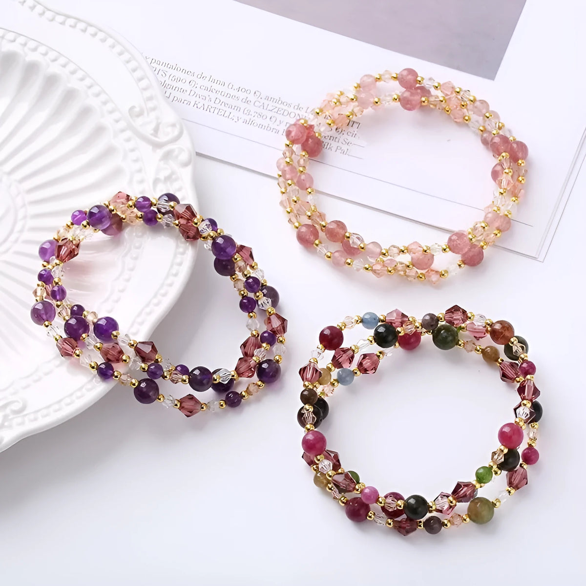 Women's adjustable crystal bracelet with three gemstone rings on rope band