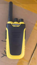 Red or yellow children's handheld intercom measuring 95mm by 53mm by 28mm with USB charging port