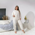 Women's creamy white polyester two-piece lounge set with crew neck top and trousers