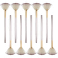 Ten champagne-finished facial fan brushes with acrylic handles and protective covers.