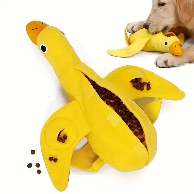 Yellow plush duck dog toy with squeaker and food leak compartment for treats.