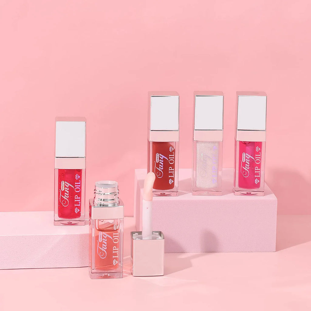 Five colour shades of moisturising lip gloss mint lipstick with lip essence oil.