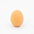 Yellow egg-shaped dog teeth cleaning toy with textured rubber surface for dental care