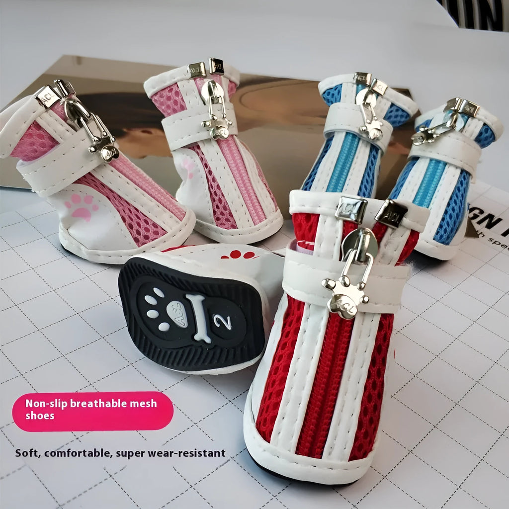 Set of four blue cloth dog shoes with zippers, designed for small breed pets on a white background.