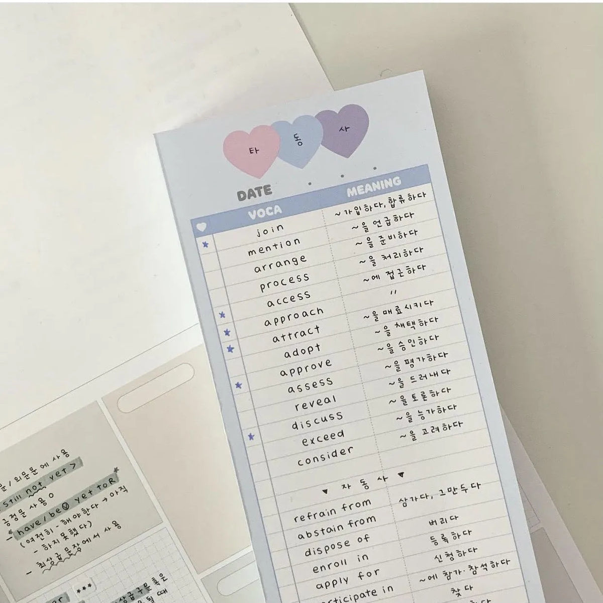 Vertical B5 half size English learning notepad with pink soft cover showing double-sided printed pages