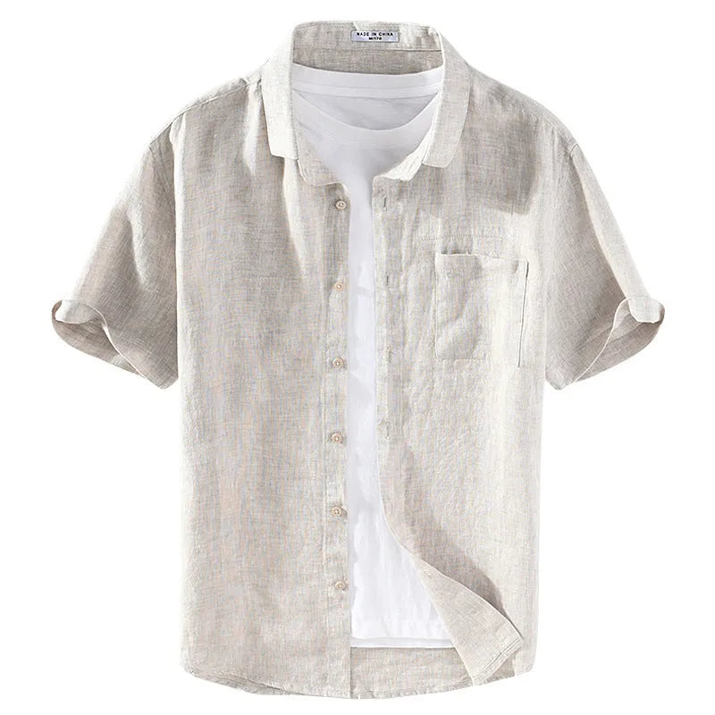 Male model wearing a short sleeve linen shirt with a square collar in raw jute colour.