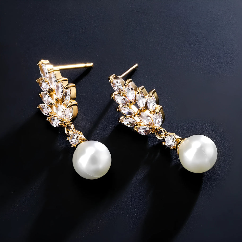 Pearl earrings with micro zircon accents in geometric flower design available in three metal plating options