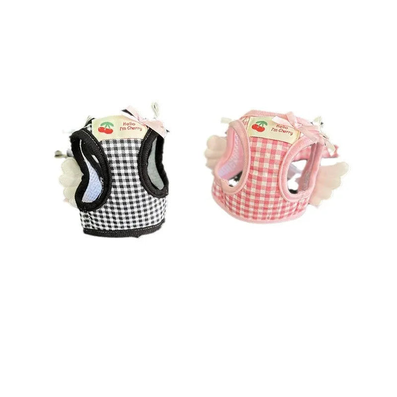 Pink cotton chest and back harness with lead for a small dog on a white background.