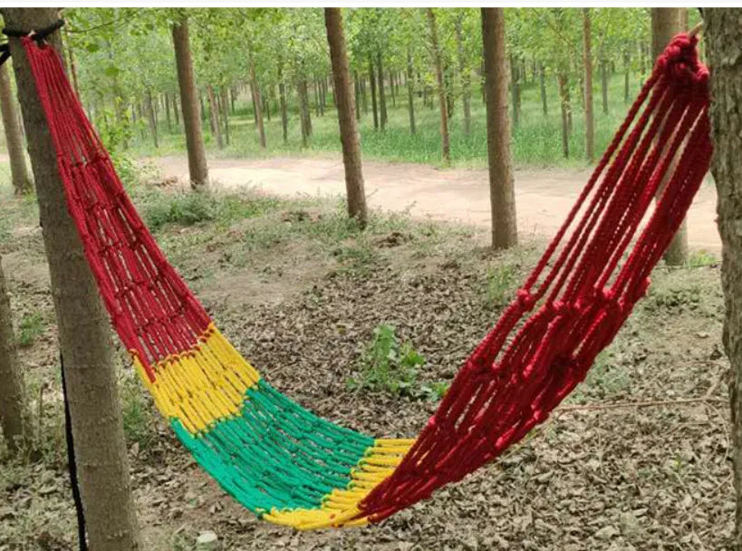 Nylon rope mesh outdoor hammock showing bold pattern construction with tying equipment