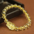 Yellow leather citrine pi xiu bracelet with artificial crystal beads and adjustable leather cord fastening
