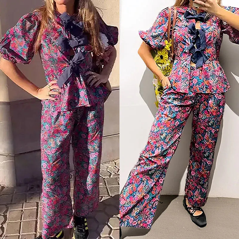 Women's floral print polyester trouser suit with puff sleeves and tie-neck blouse