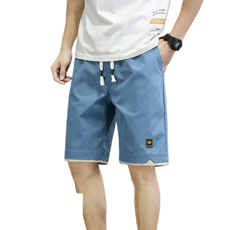 Korean style loose straight-leg casual shorts on a hanger in a khaki colour.