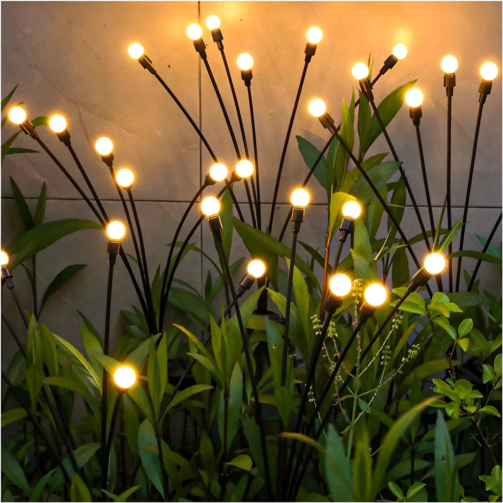 Solar-powered LED firefly lawn light with multiple heads and a stainless steel ground spike