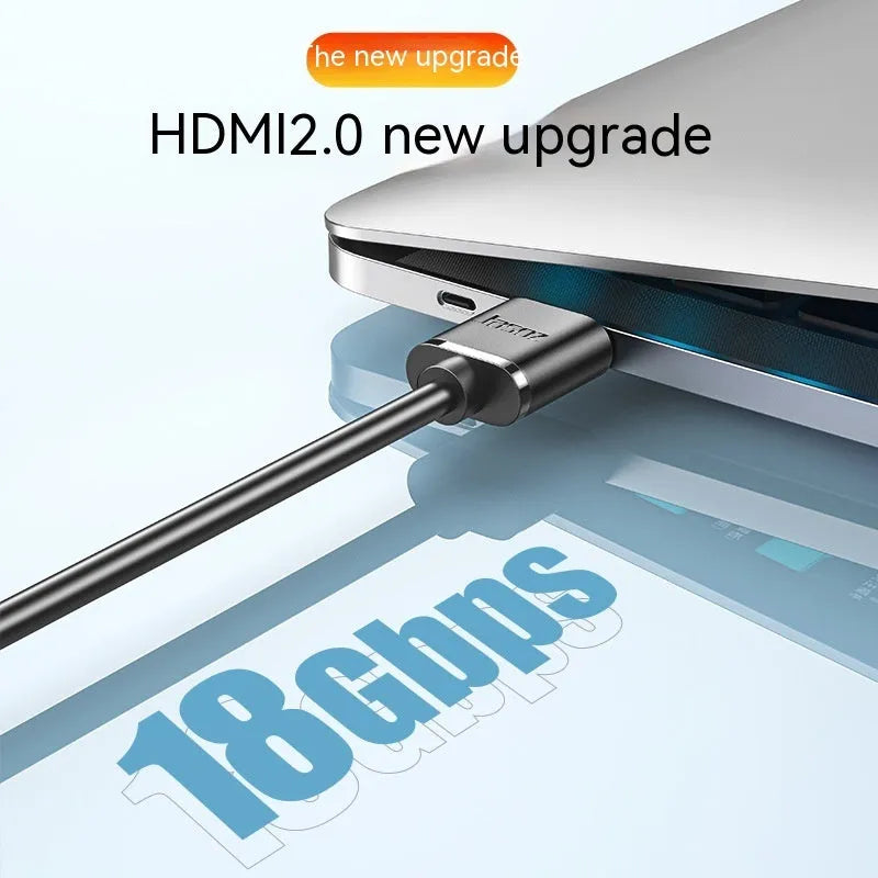 Flexible HDMI video cable with gold-plated connectors, shown in a hairline finish, suitable for computers and projectors.