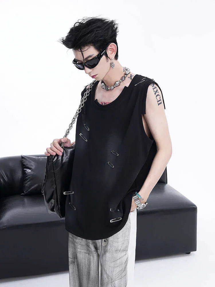 Man modelling a black ripped sleeveless waistcoat vest with an irregular hem and distressed detailing