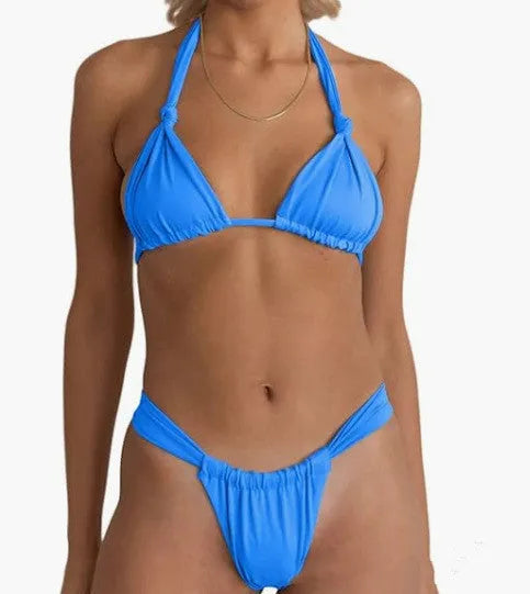 Women's knotted pleated bikini swimsuit in solid colour on a mannequin.