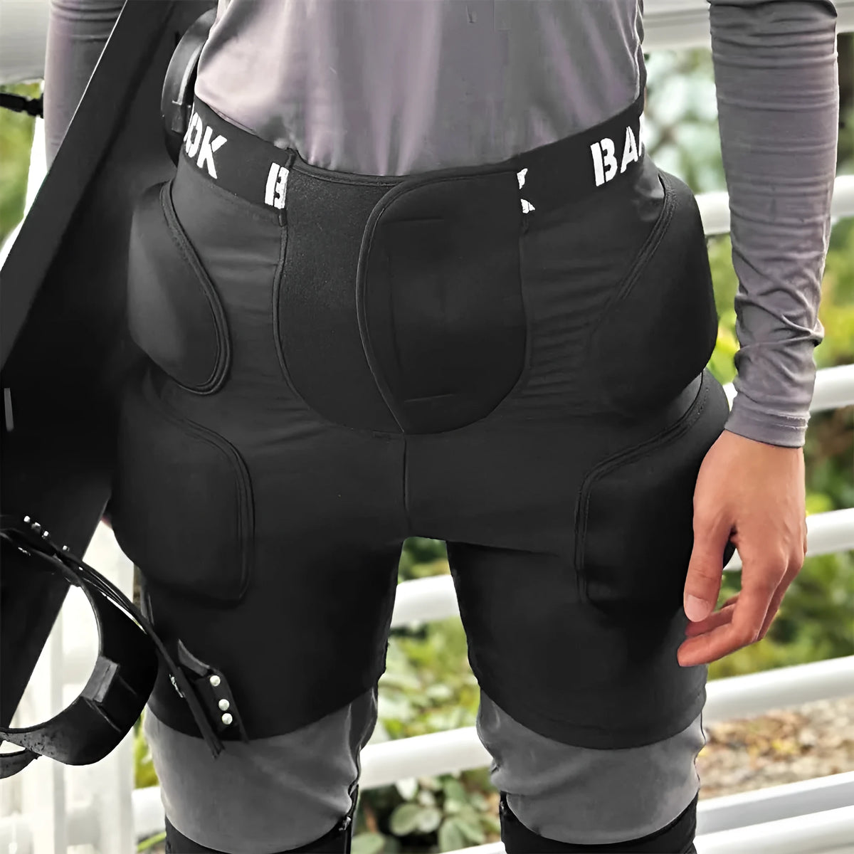 Black BA103 protective hip pad with elastic leg straps for roller skating and skateboarding safety.