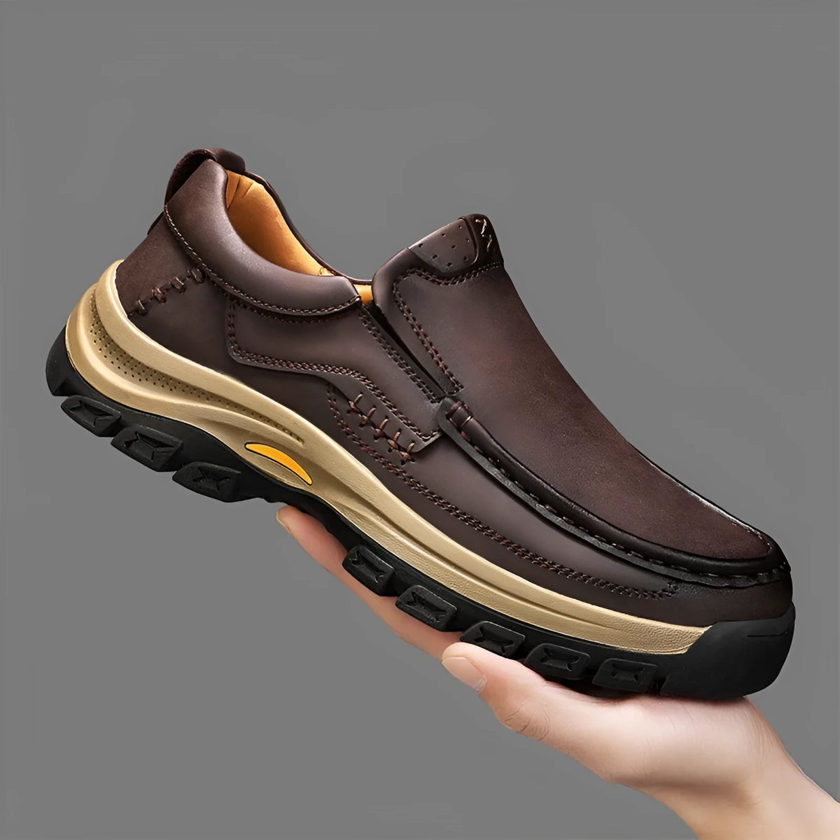 Men's black thick-soled leather mountaineering shoes with round toe and rubber sole.