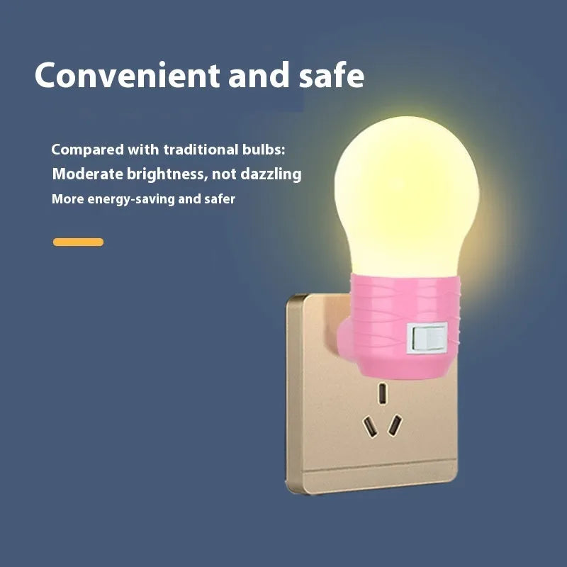 Plug-in bedside baby night lamp in white, blue, or pink shell with round modern design.
