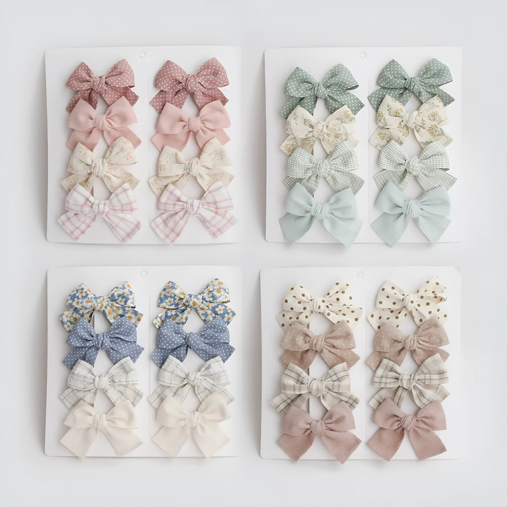 Children's cloth bow hairclips set with dovetail design in multiple colour patterns