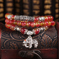 Natural watermelon crystal bracelet with Chinese knot closure and geometric beads