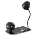 White and black three-in-one desk lamp with integrated digital clock and wireless charging pad.