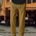 Men's polyester trousers in light grey colour shown flat