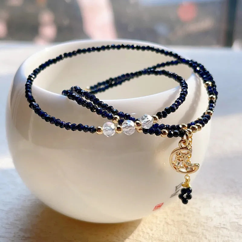 Blue and gold multi-layer women's bracelet with cut sand stone on a three-ring design.