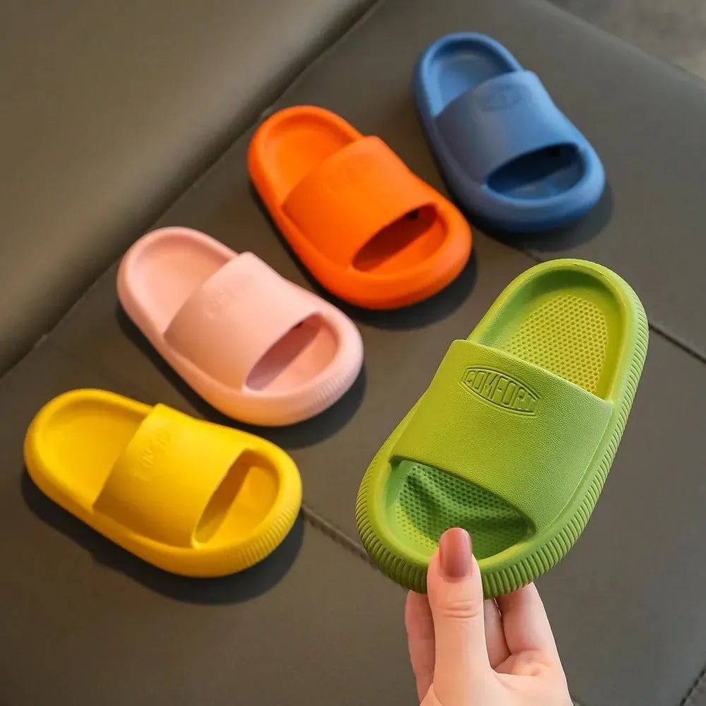 Children's EVA slippers in mixed colours with a textured non-slip sole, shown in sizes for kids.