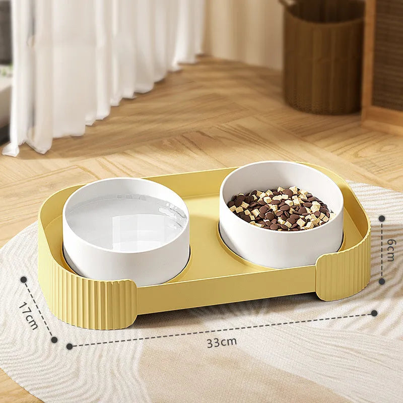 Ceramic elevated cat bowls with 15-degree tilt, non-slip base, and spill-proof rim in green colour