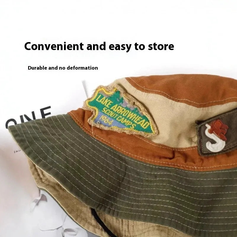 Army green women's fisherman hat with patchwork design and hand-painted details