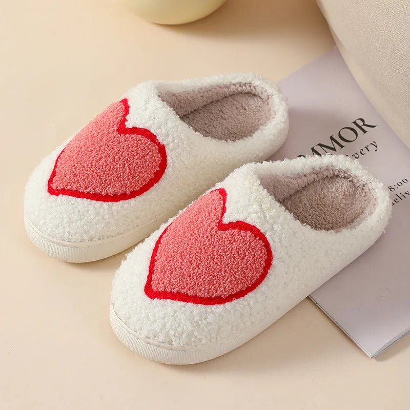 Women's plush cartoon love style home slippers with a round toe and PVC sole.