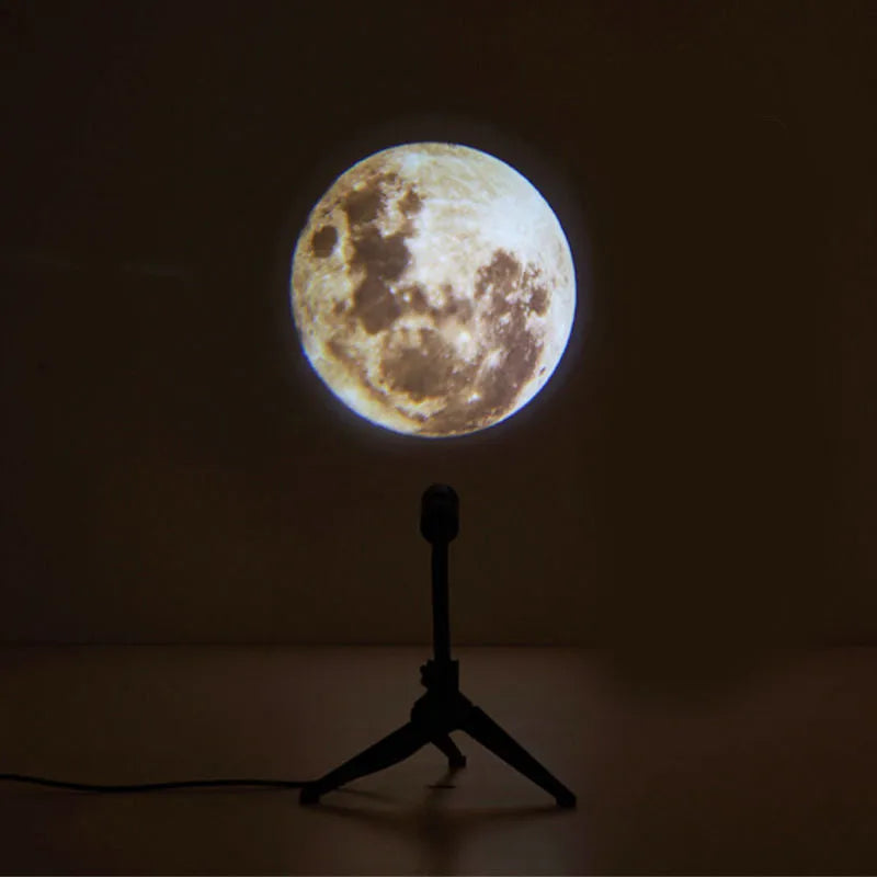 USB-powered earth and moon star projector night light with adjustable hose bracket on a bedside table.