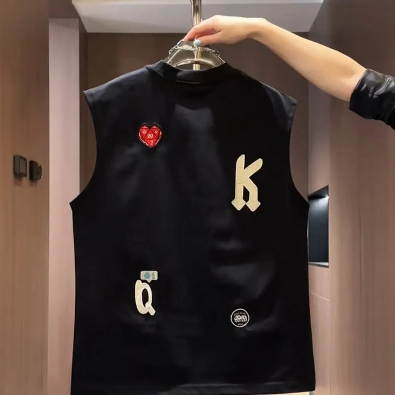 Men's black cotton sleeveless vest T-shirt with a cartoon print graphic, showing loose fit.